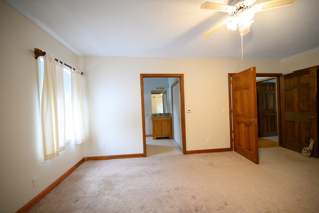 89 Potwine Lane Amherst, MA 01002 - Photo 17 of 41 a view of empty room with window and ceiling fan