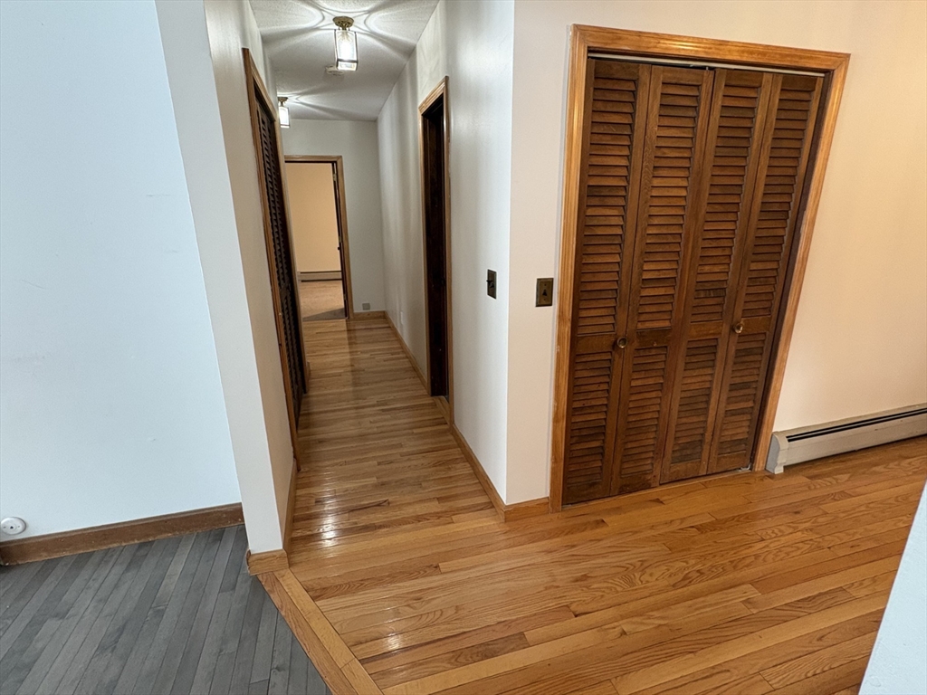 89 Potwine Lane Amherst, MA 01002 - Photo 18 of 41 a view of hallway with wooden floor