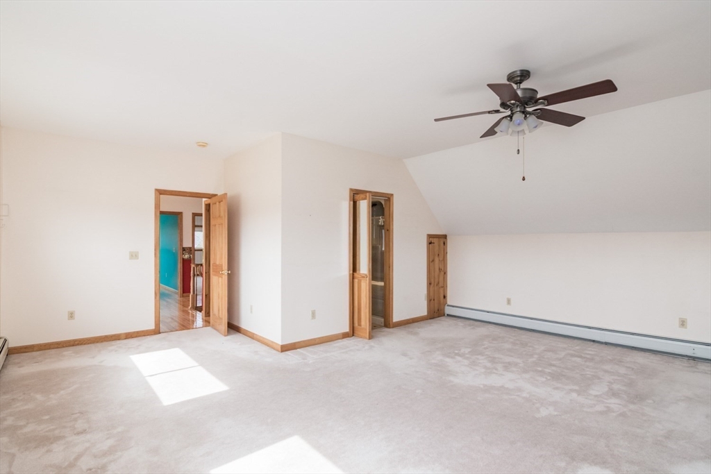 89 Potwine Lane Amherst, MA 01002 - Photo 20 of 37 an empty room with closet and a chandelier fan