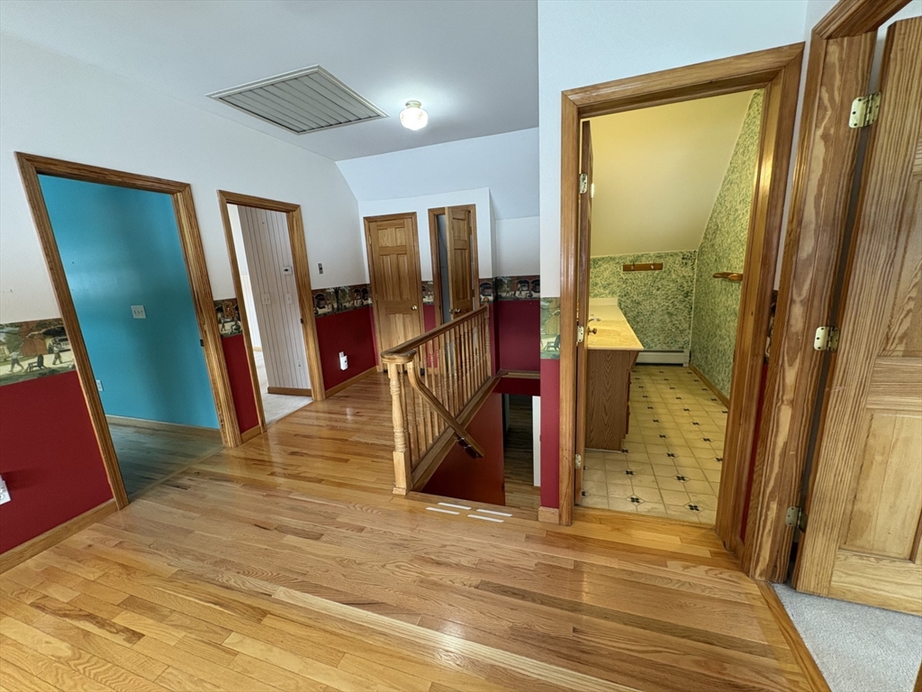 89 Potwine Lane Amherst, MA 01002 - Photo 24 of 41 a view of a hallway with wooden floor and windows