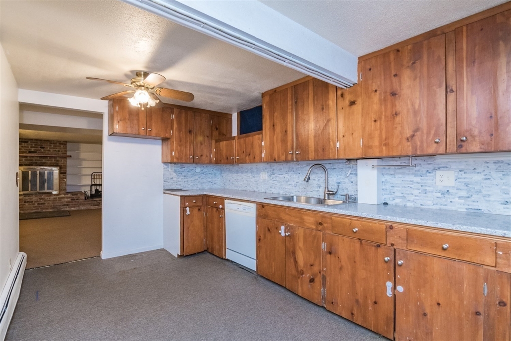 89 Potwine Lane Amherst, MA 01002 - Photo 27 of 37 a kitchen with cabinets a sink and dishwasher