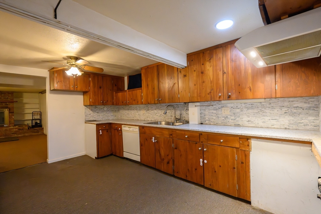 89 Potwine Lane Amherst, MA 01002 - Photo 32 of 41 a kitchen with granite countertop a sink cabinets and stainless steel appliances