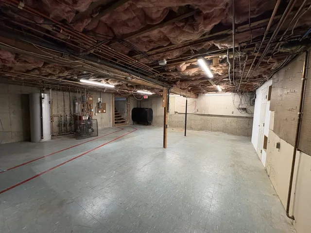 a view of empty room with wooden walls