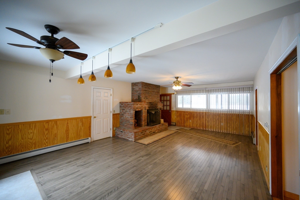 89 Potwine Lane Amherst, MA 01002 - Photo 6 of 41 a view of empty room with wooden floor and fan