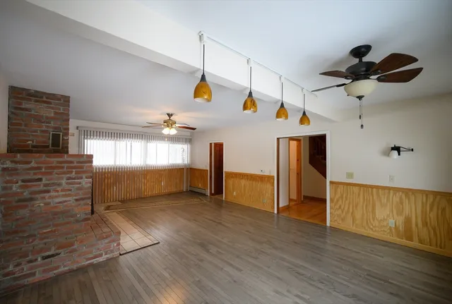 a view of an entryway with wooden floor