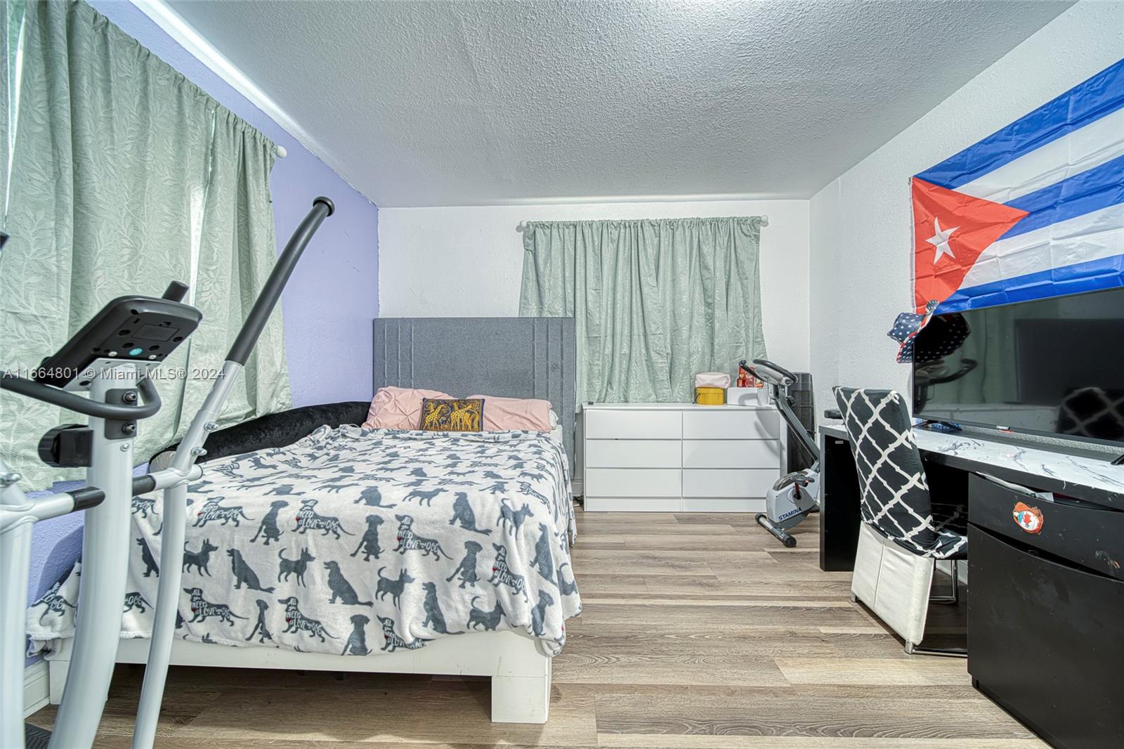2000 Service Road Opa-Locka, FL 33054 - Photo 30 of 34 a bedroom with a bed and large windows