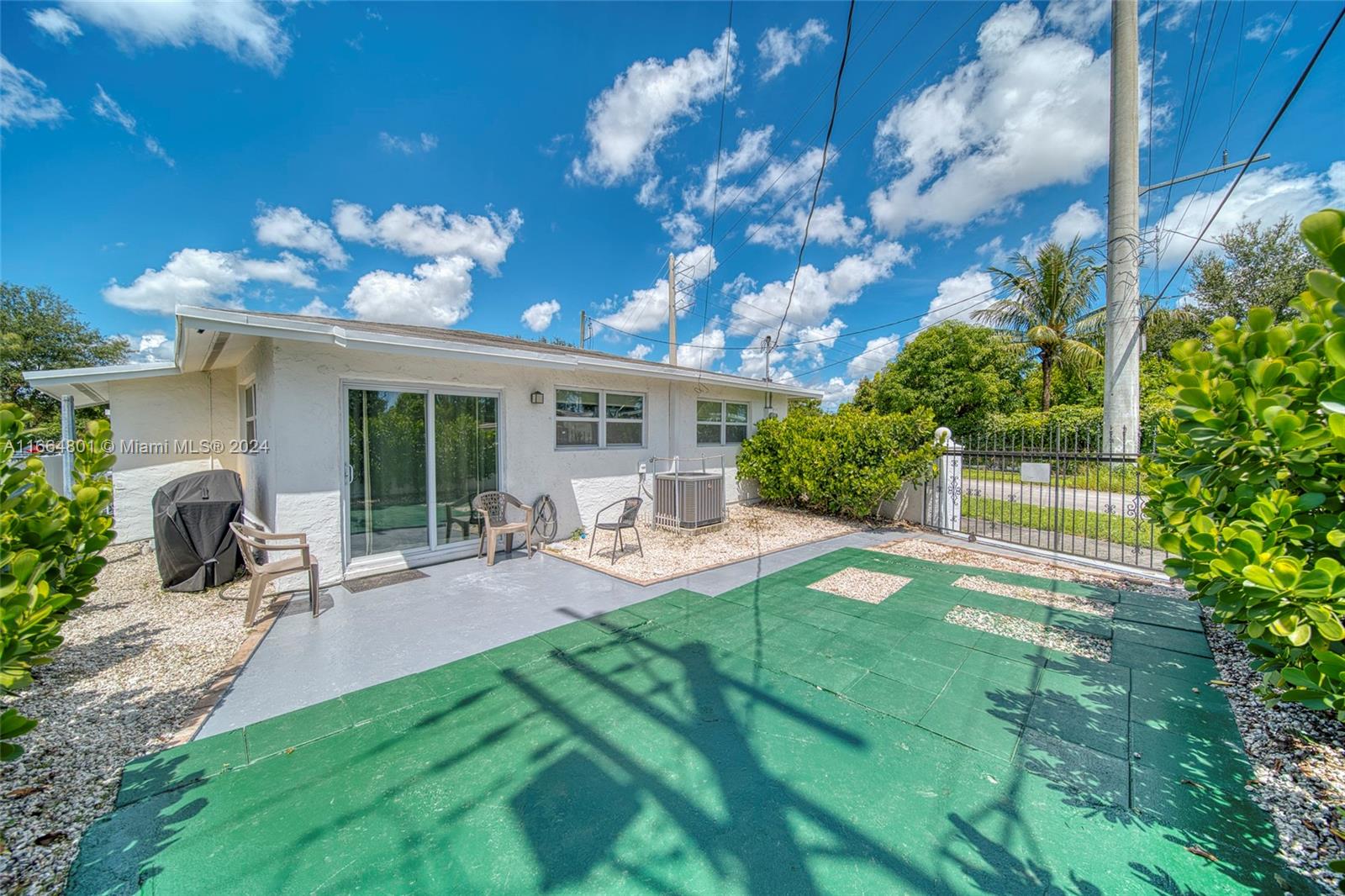2000 Service Road Opa-Locka, FL 33054 - Photo 34 of 34 a view of a house with backyard porch and sitting area