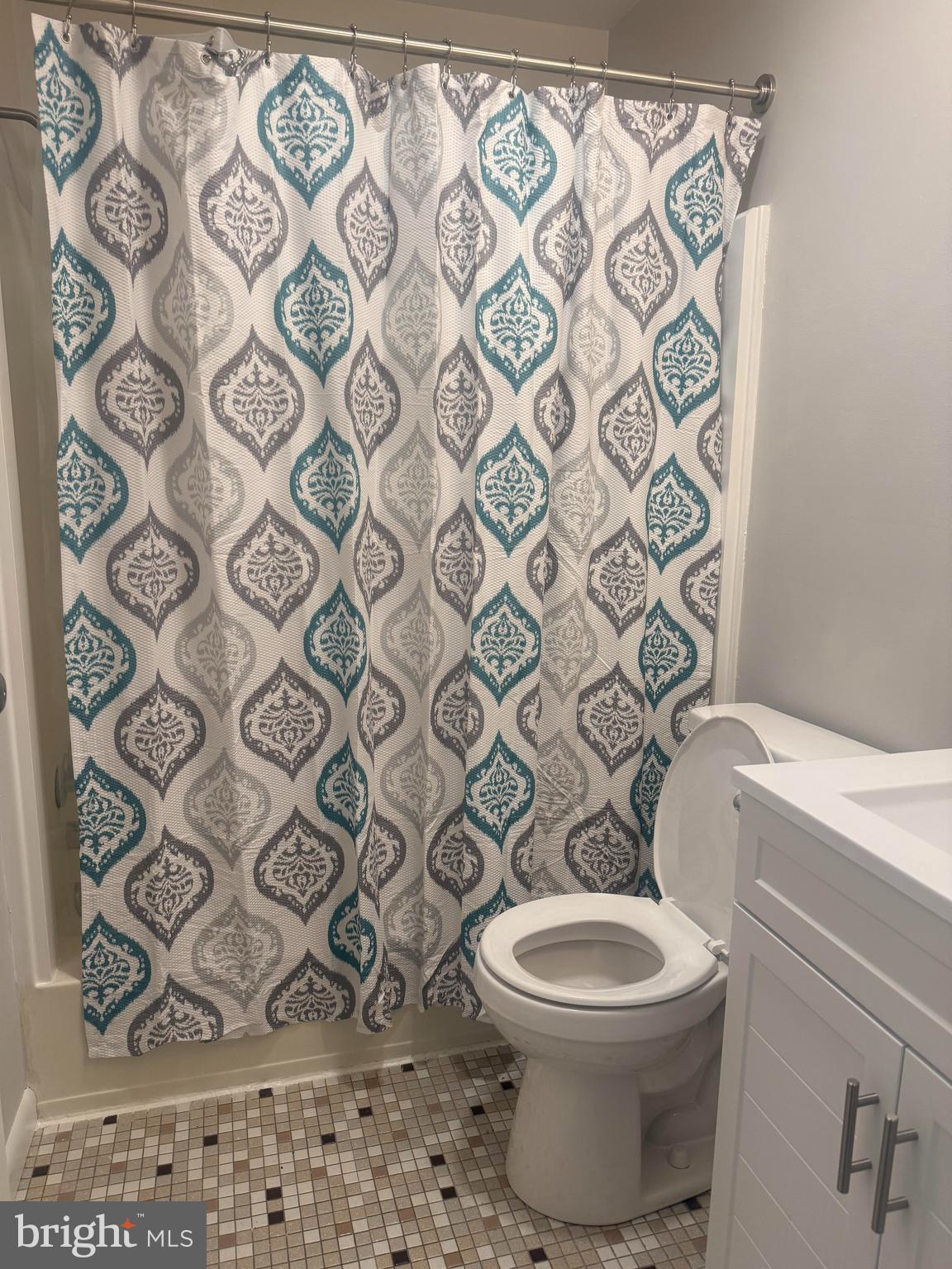 74 Lancaster Estates Mount Joy, PA 17552 - Photo 6 of 6 a white toilet sitting next to a shower curtain