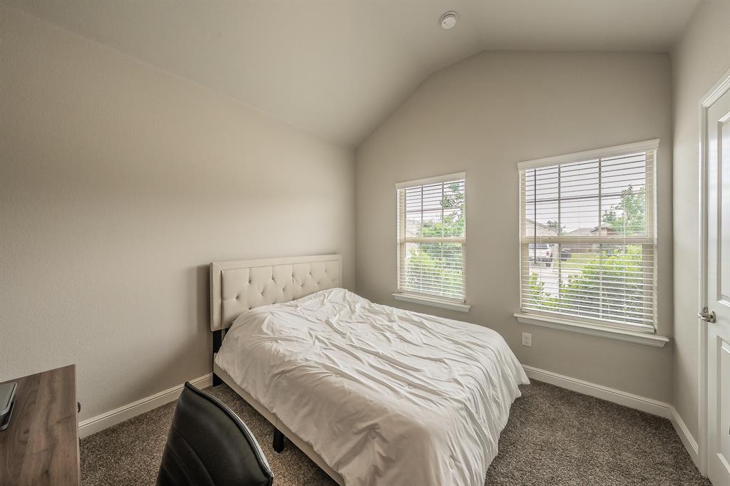 1212 Bosque Lane Weatherford, TX 76087 - Photo 20 of 38 a bed sitting in a bedroom next to a window