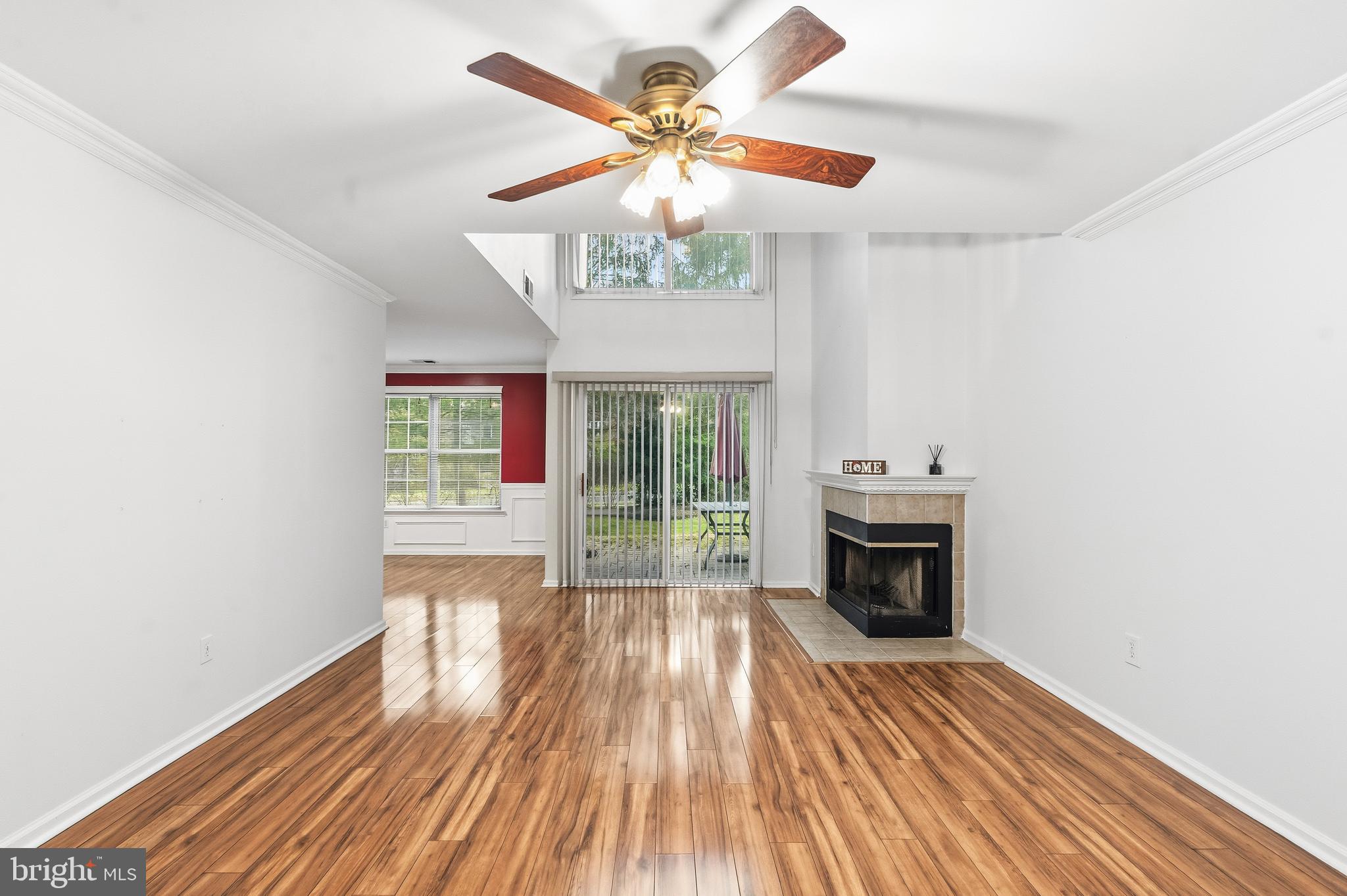 8 Brookline Court, Unit B Princeton, NJ 08540 - Photo 11 of 53 a view of an empty room with a window and wooden floor
