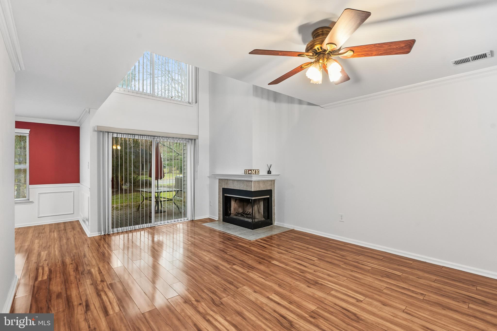 8 Brookline Court, Unit B Princeton, NJ 08540 - Photo 12 of 53 a view of an empty room with a window and wooden floor