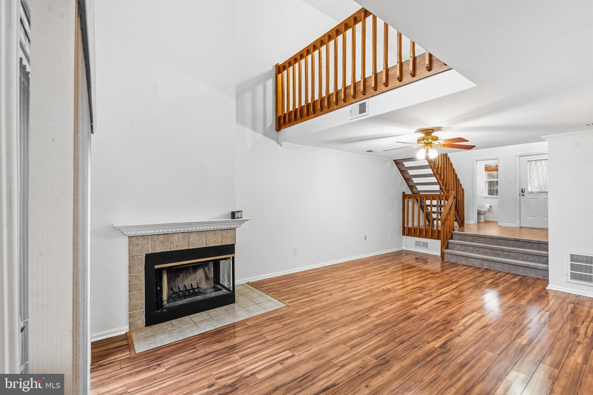 8 Brookline Court, Unit B Princeton, NJ 08540 - Photo 15 of 53 a view of empty room with stairs and wooden floor