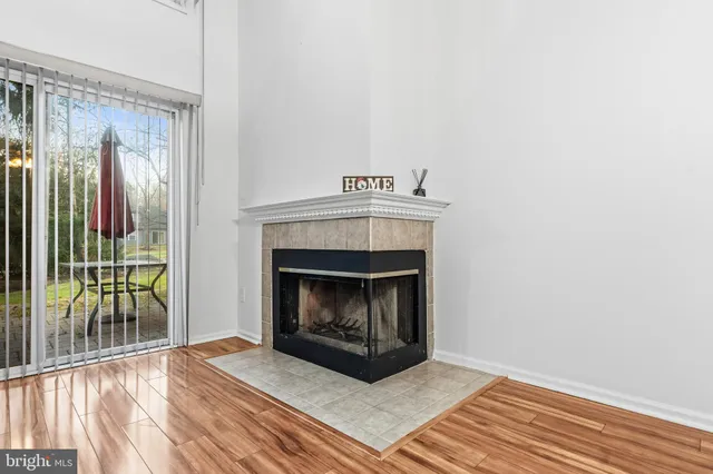 a kitchen with granite countertop a refrigerator and a stove top oven