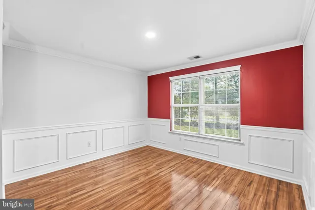 a kitchen with stainless steel appliances granite countertop a stove top oven a sink a counter space and cabinets