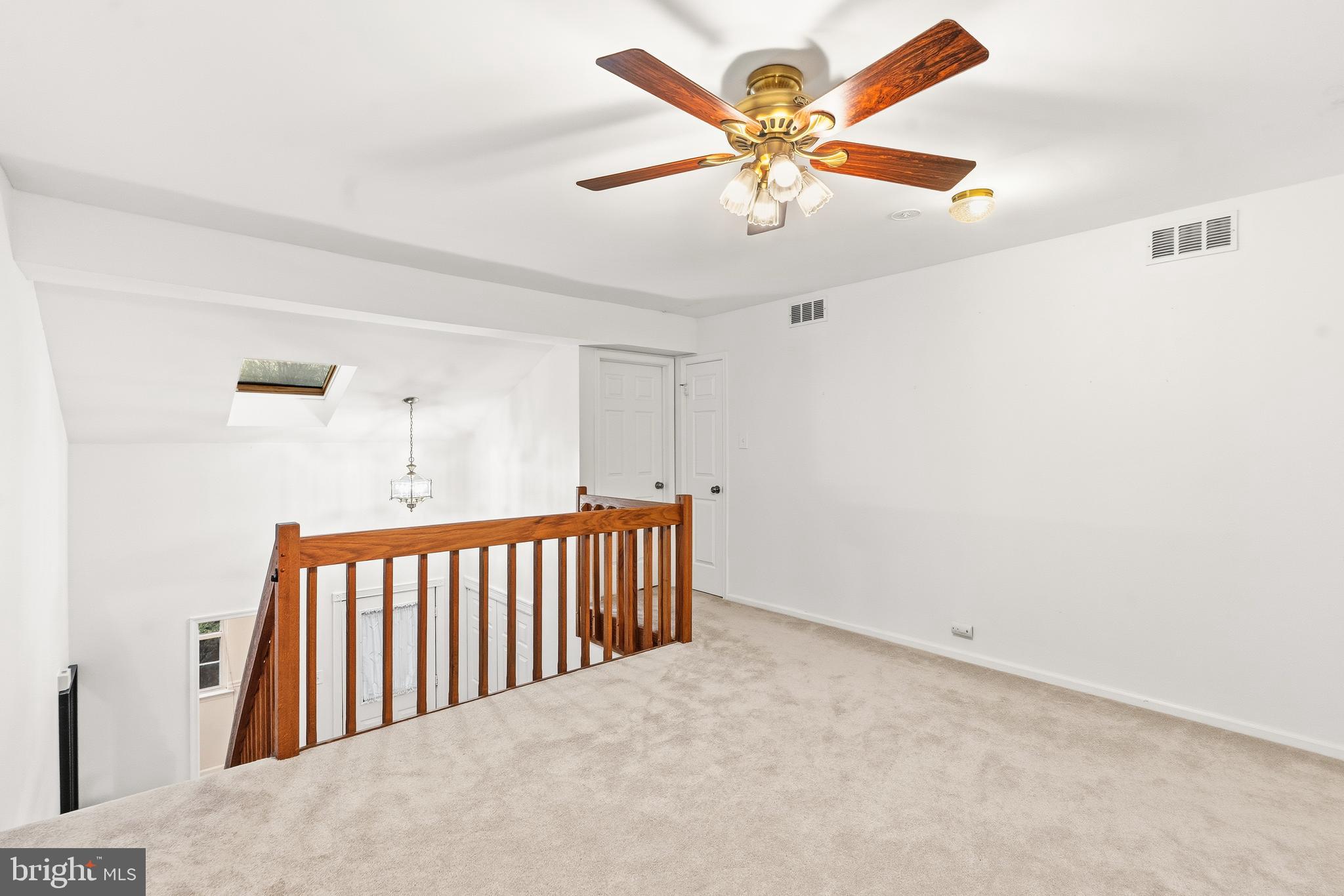 8 Brookline Court, Unit B Princeton, NJ 08540 - Photo 36 of 53 an empty room with ceiling fan and windows