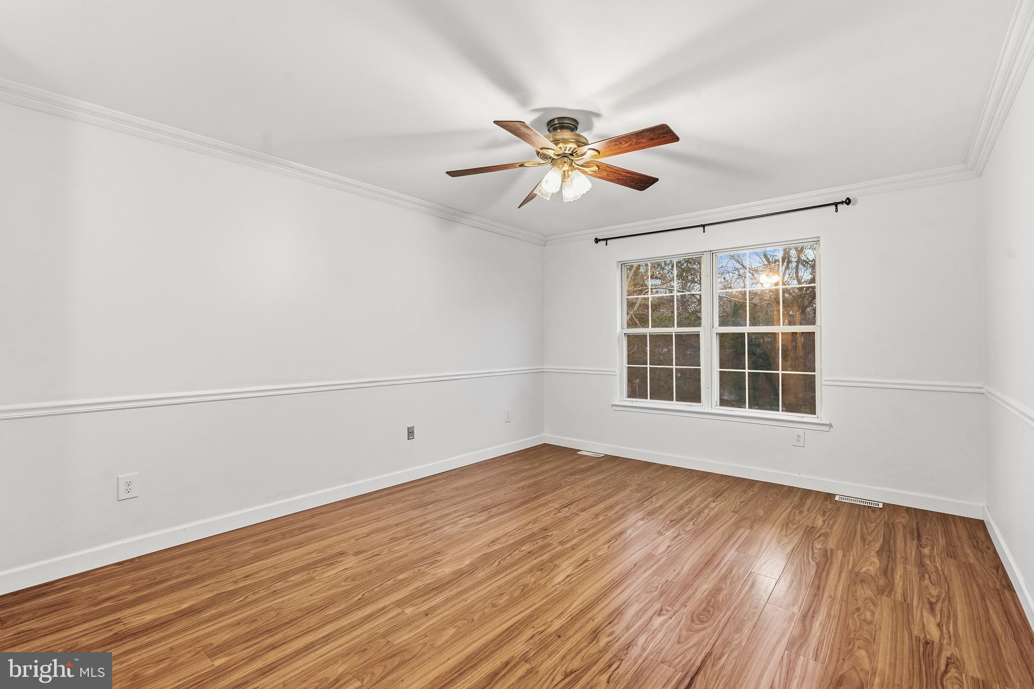 8 Brookline Court, Unit B Princeton, NJ 08540 - Photo 37 of 53 a view of empty room with wooden floor and fan