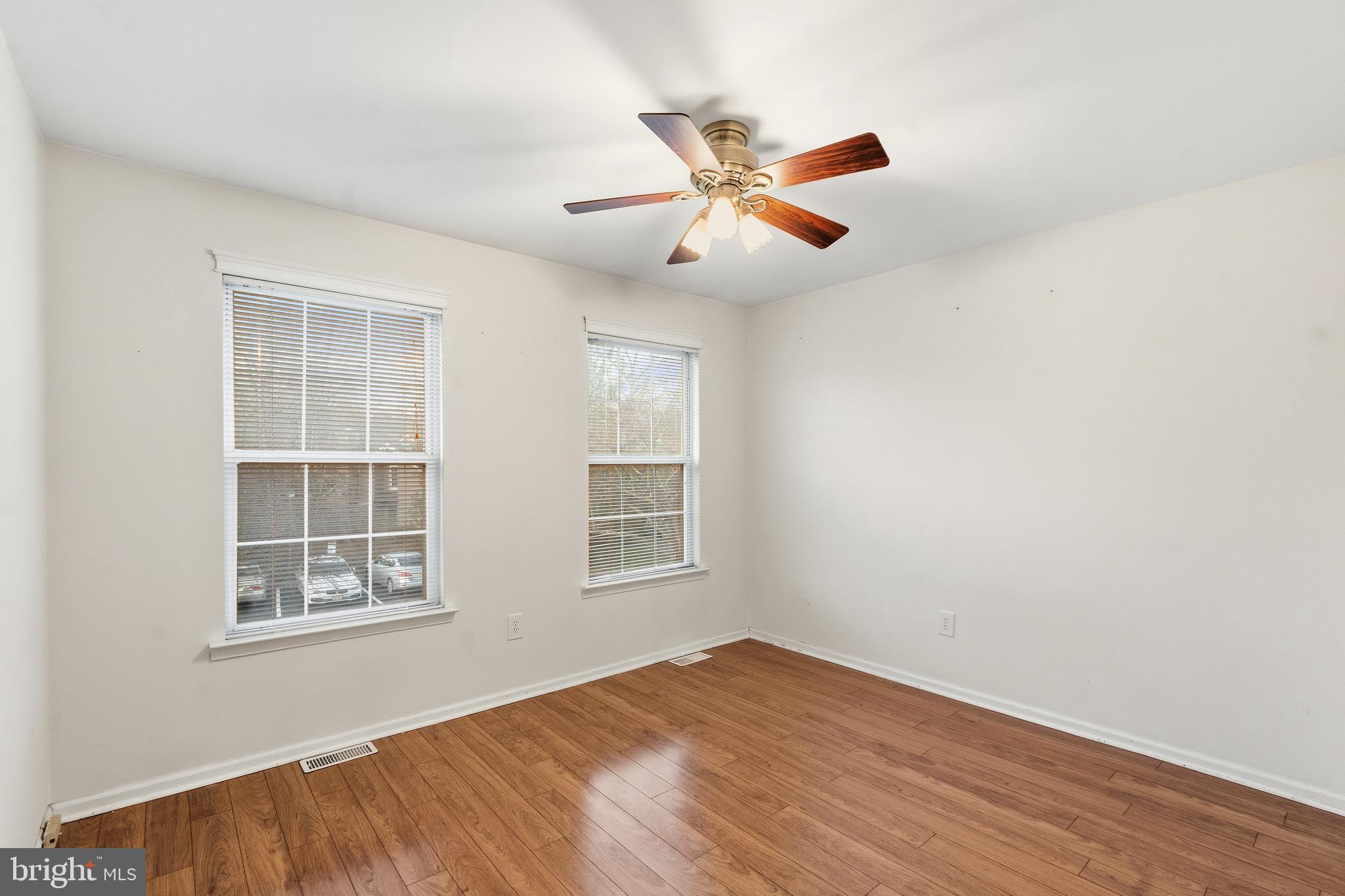 8 Brookline Court, Unit B Princeton, NJ 08540 - Photo 44 of 53 a view of an empty room with wooden floor and a window