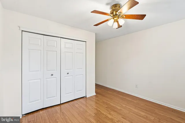 a view of a tables and chairs in back yard of a house