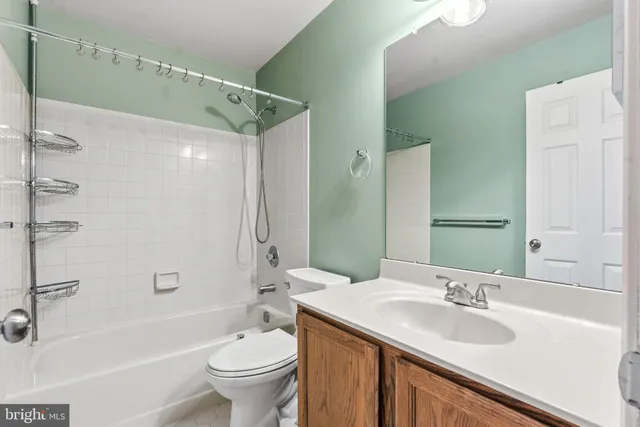 a view of house with backyard and sitting area