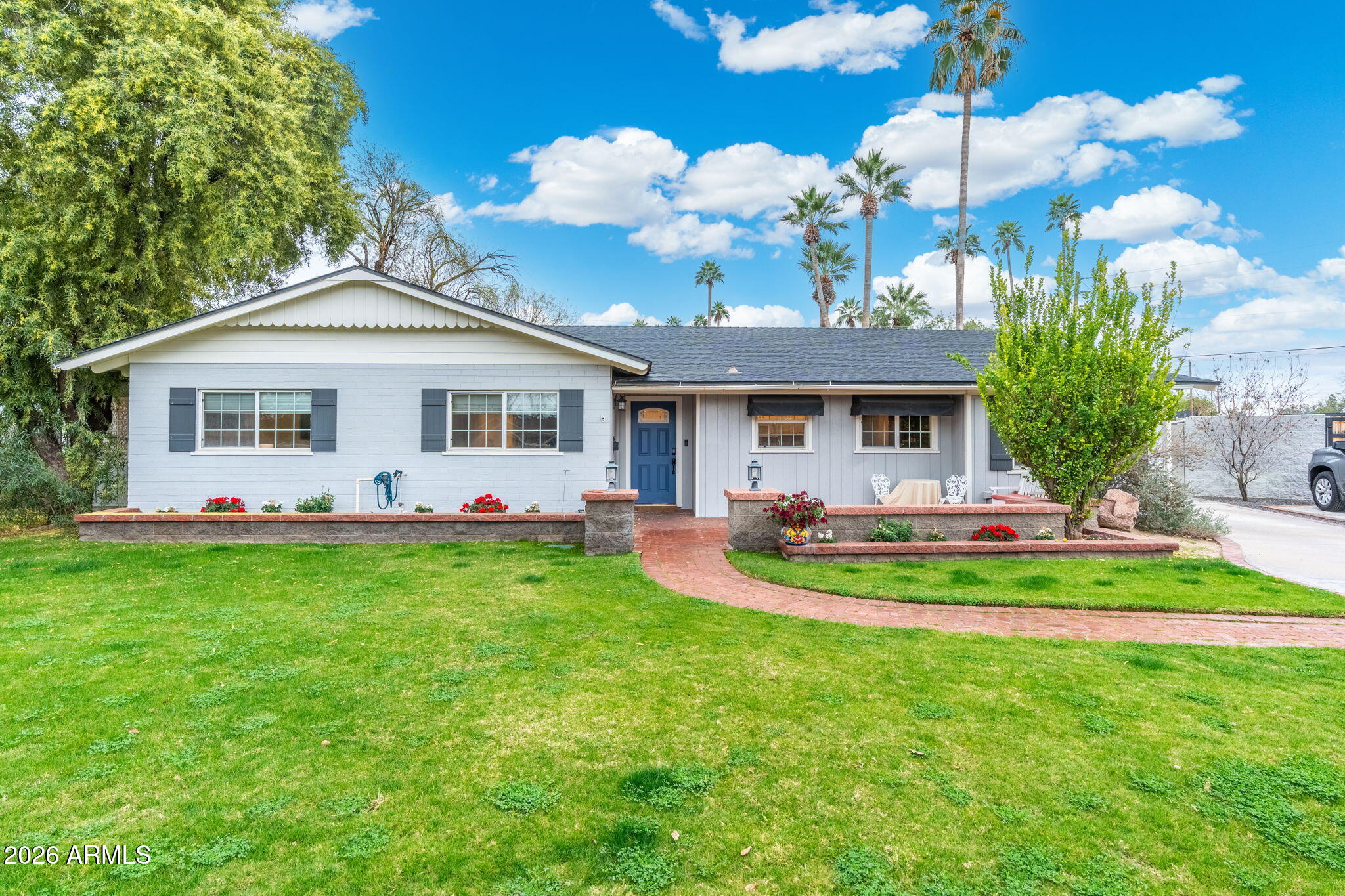 a front view of a house with swimming pool having outdoor seating