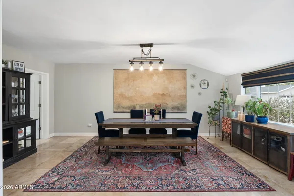 a view of a dining room with furniture window and outside view