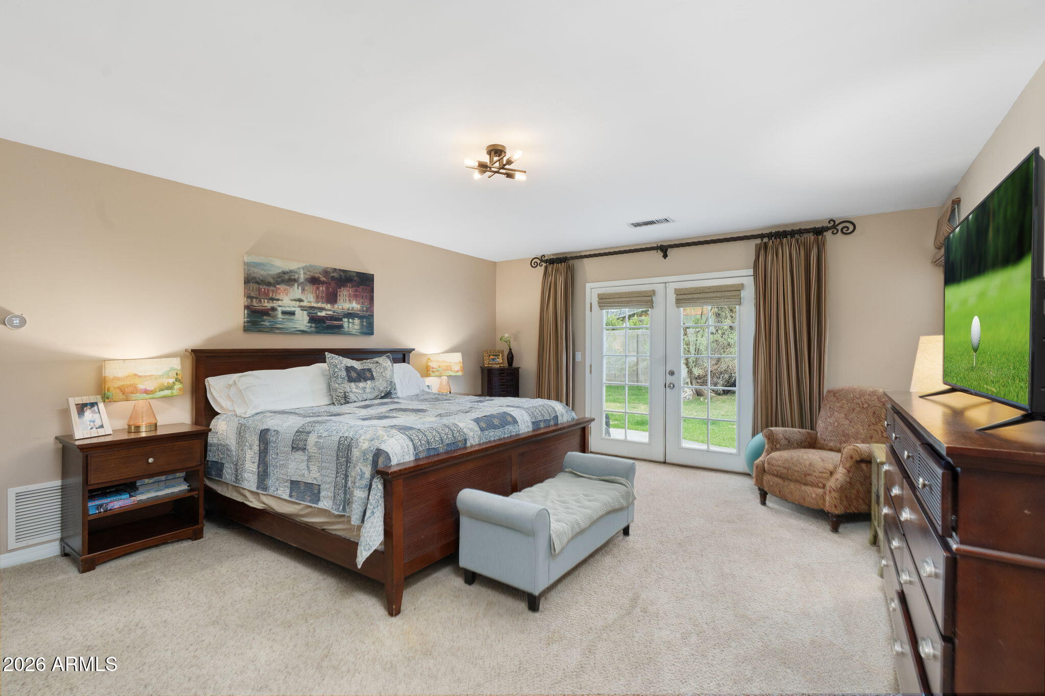 3033 North 53rd Street Phoenix, AZ 85018 - Photo 14 of 40 a spacious bedroom with a bed and a couch