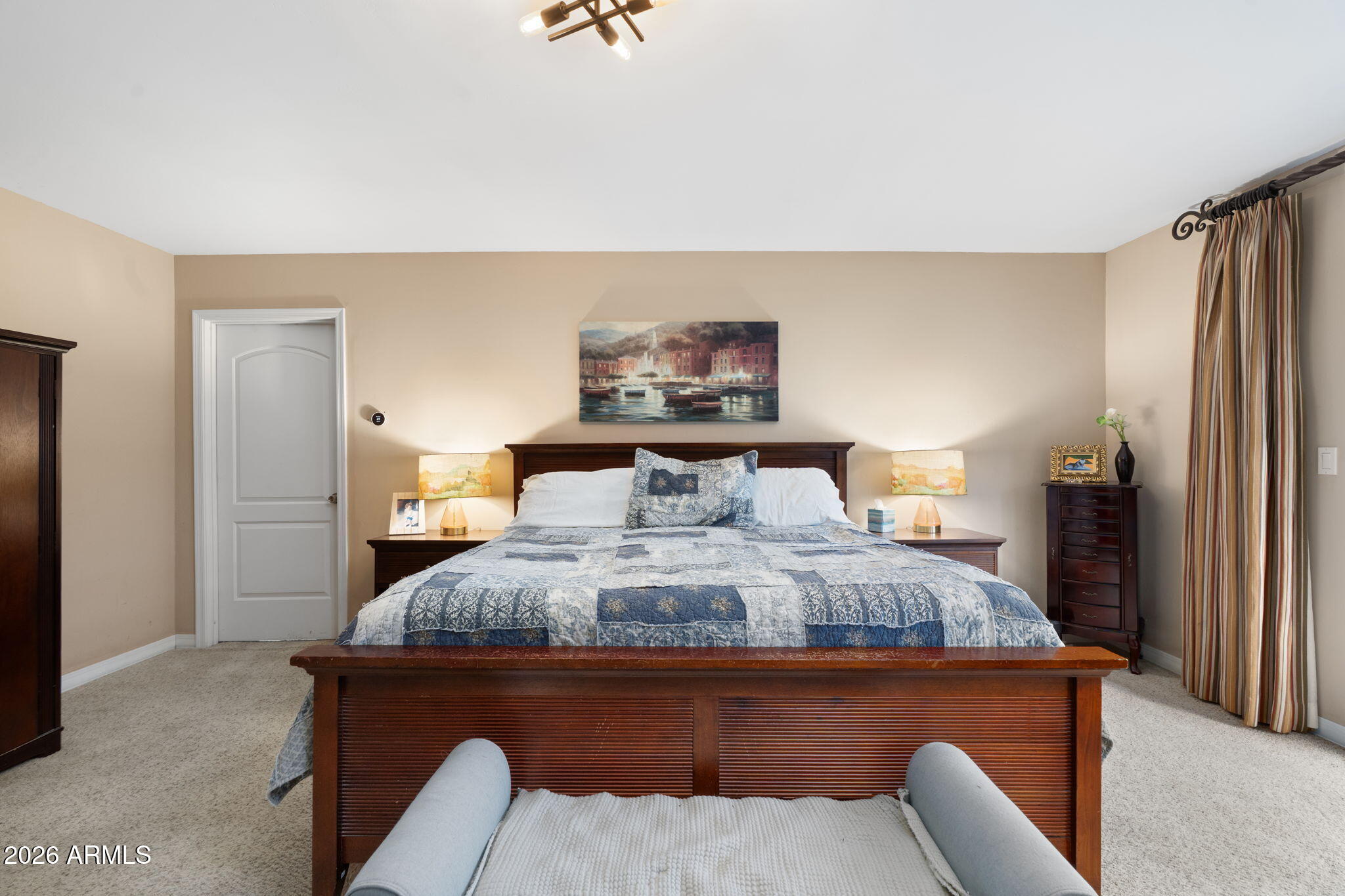 3033 North 53rd Street Phoenix, AZ 85018 - Photo 15 of 40 a bedroom with a bed and a painting on the wall