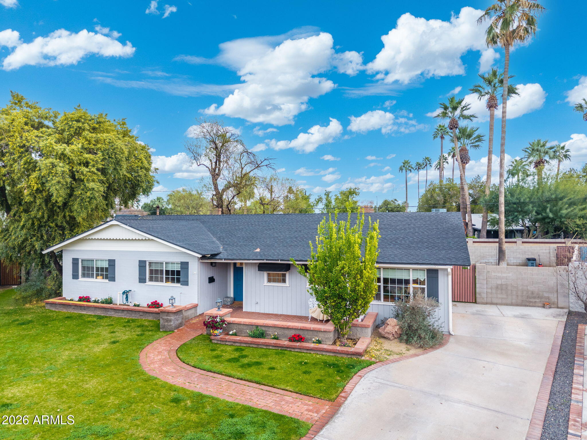 3033 North 53rd Street Phoenix, AZ 85018 - Photo 2 of 40 a front view of a house with a garden and plants