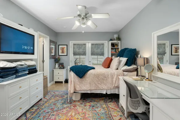 a view of a livingroom with workspace and a window