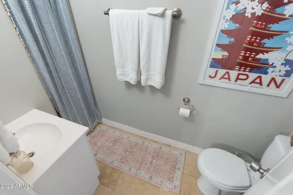 a kitchen with sink a stove and cabinets