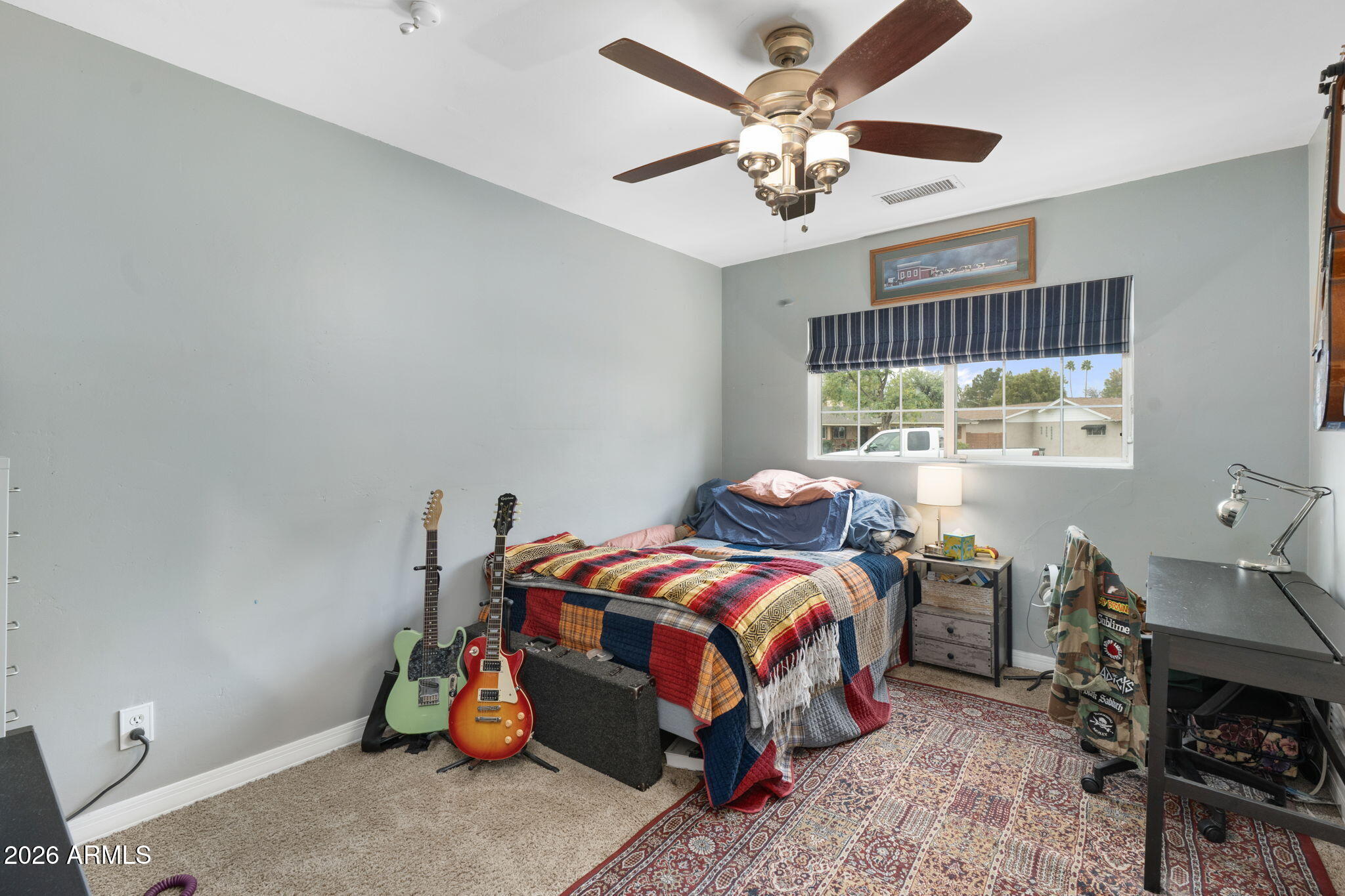 3033 North 53rd Street Phoenix, AZ 85018 - Photo 23 of 40 a bedroom with a bed a table and chair