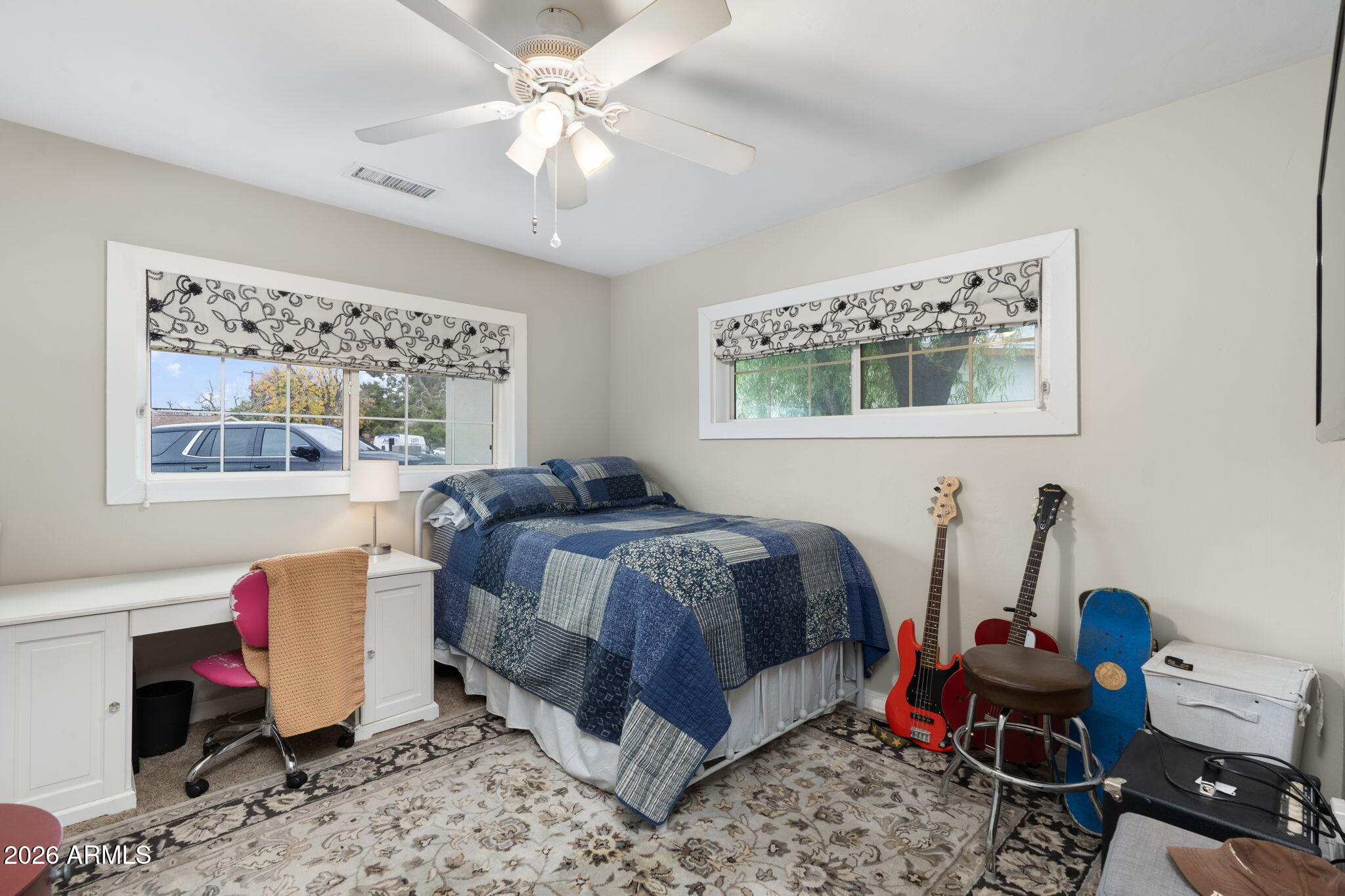 3033 North 53rd Street Phoenix, AZ 85018 - Photo 25 of 40 a bedroom with a bed and a chandelier