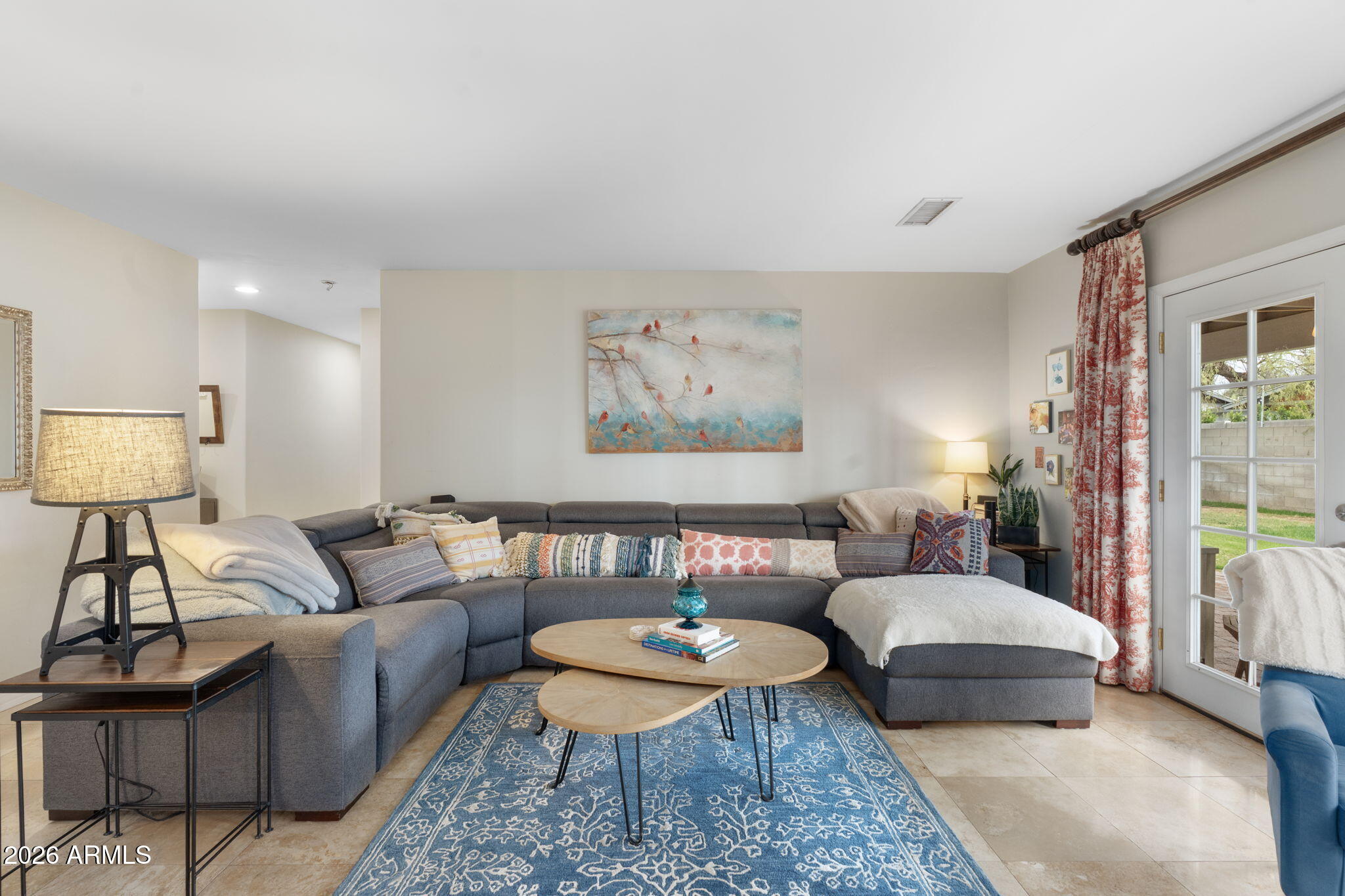 3033 North 53rd Street Phoenix, AZ 85018 - Photo 3 of 40 a living room with furniture and a rug