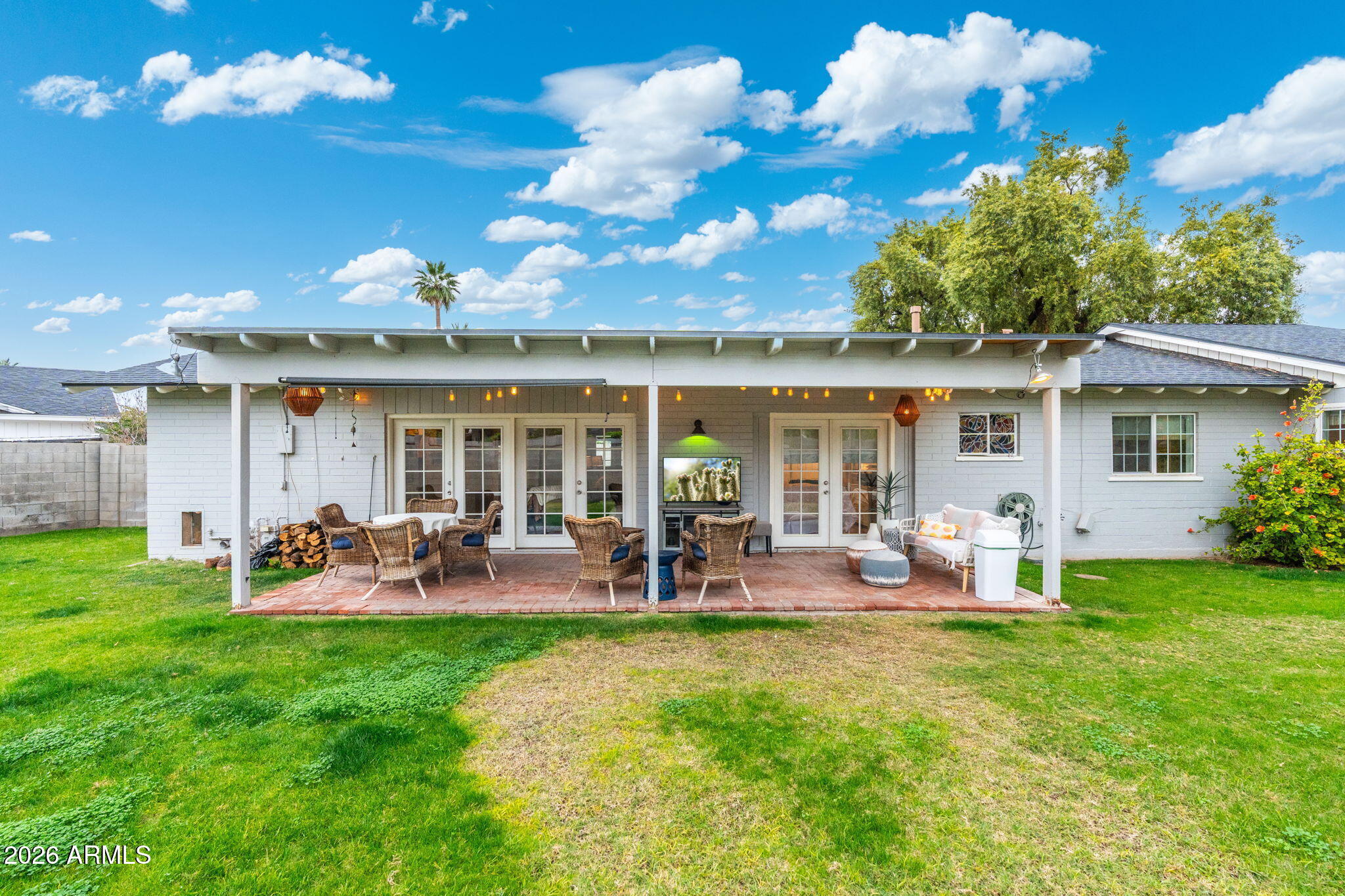 3033 North 53rd Street Phoenix, AZ 85018 - Photo 31 of 40 a view of a house with backyard sitting area and garden