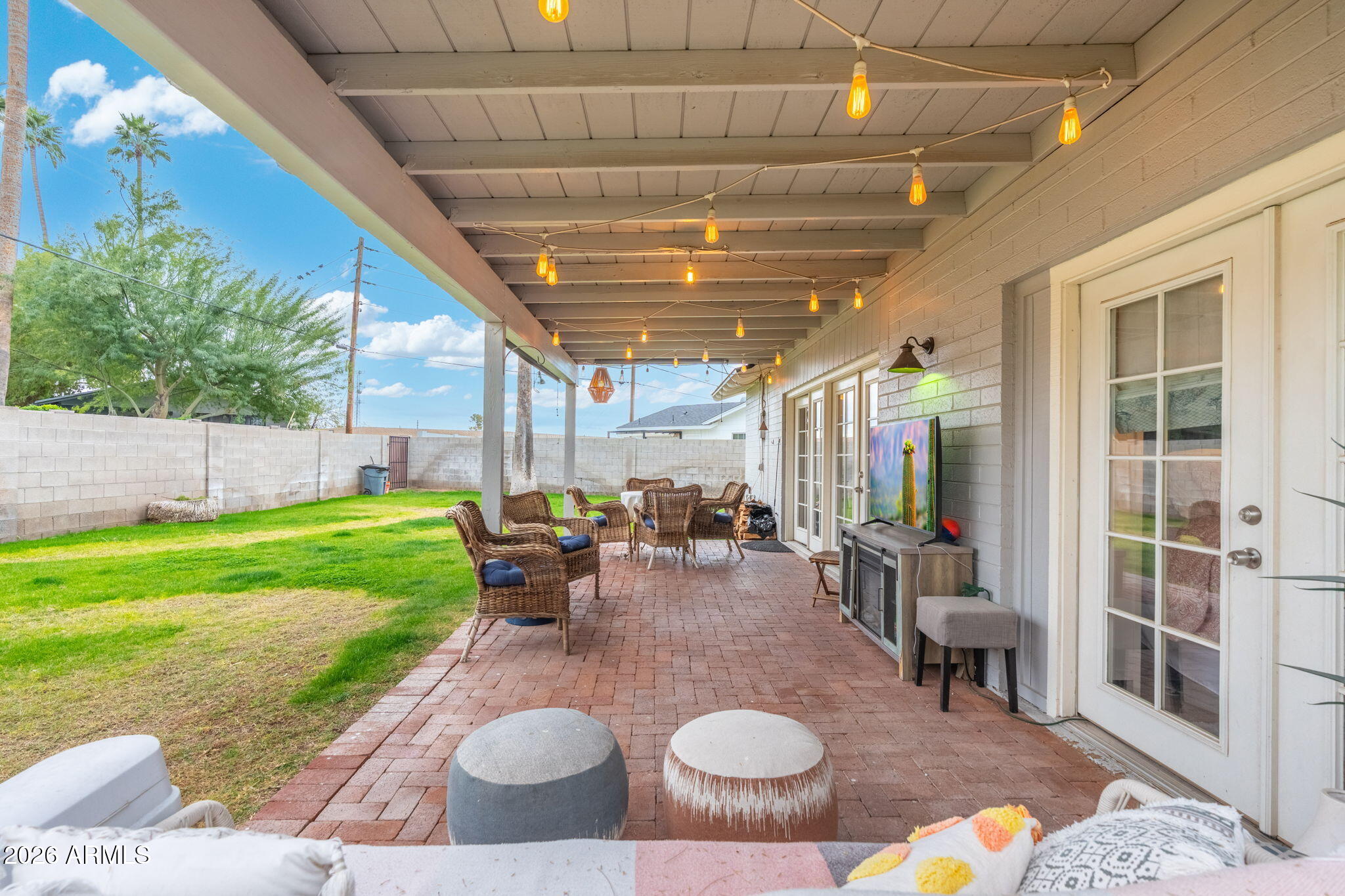 3033 North 53rd Street Phoenix, AZ 85018 - Photo 32 of 40 a view of a porch with chairs and a yard