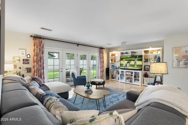 a living room with furniture and a large window
