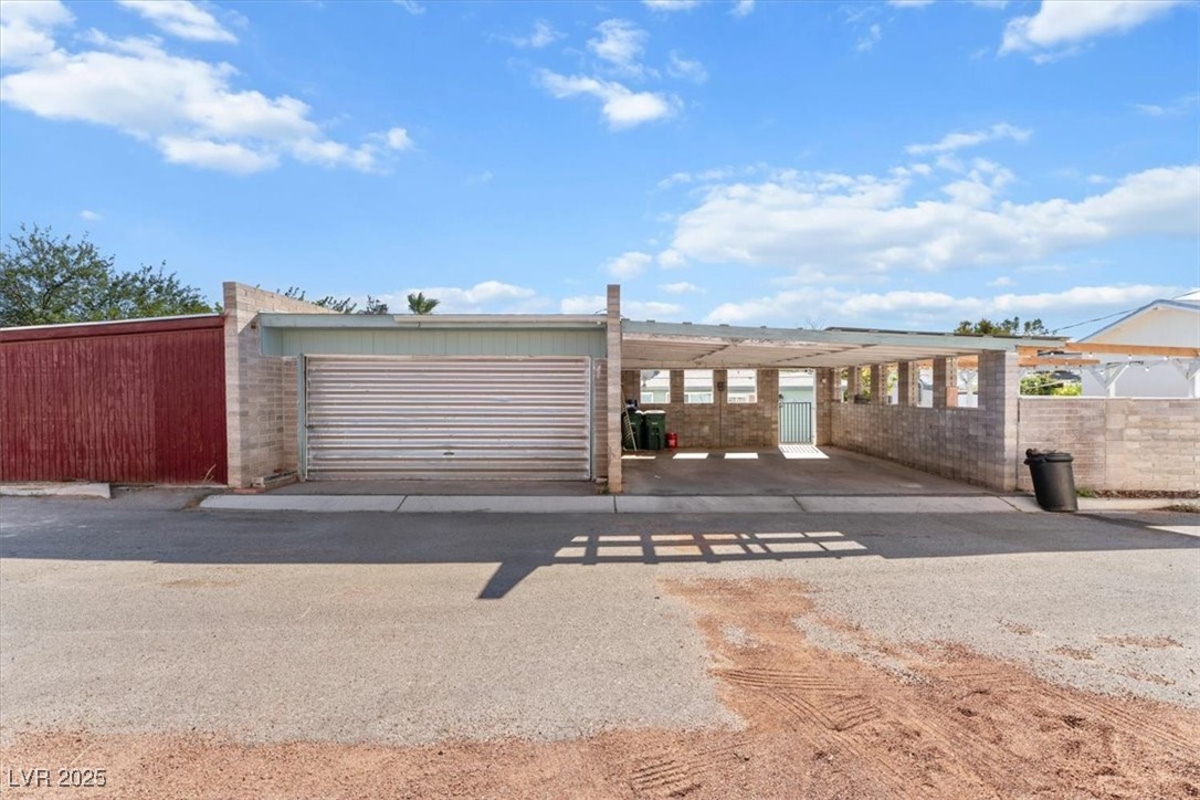 556 7th Street Boulder City, NV 89005 - Photo 27 of 37 Two-Car Garage featuring a gate