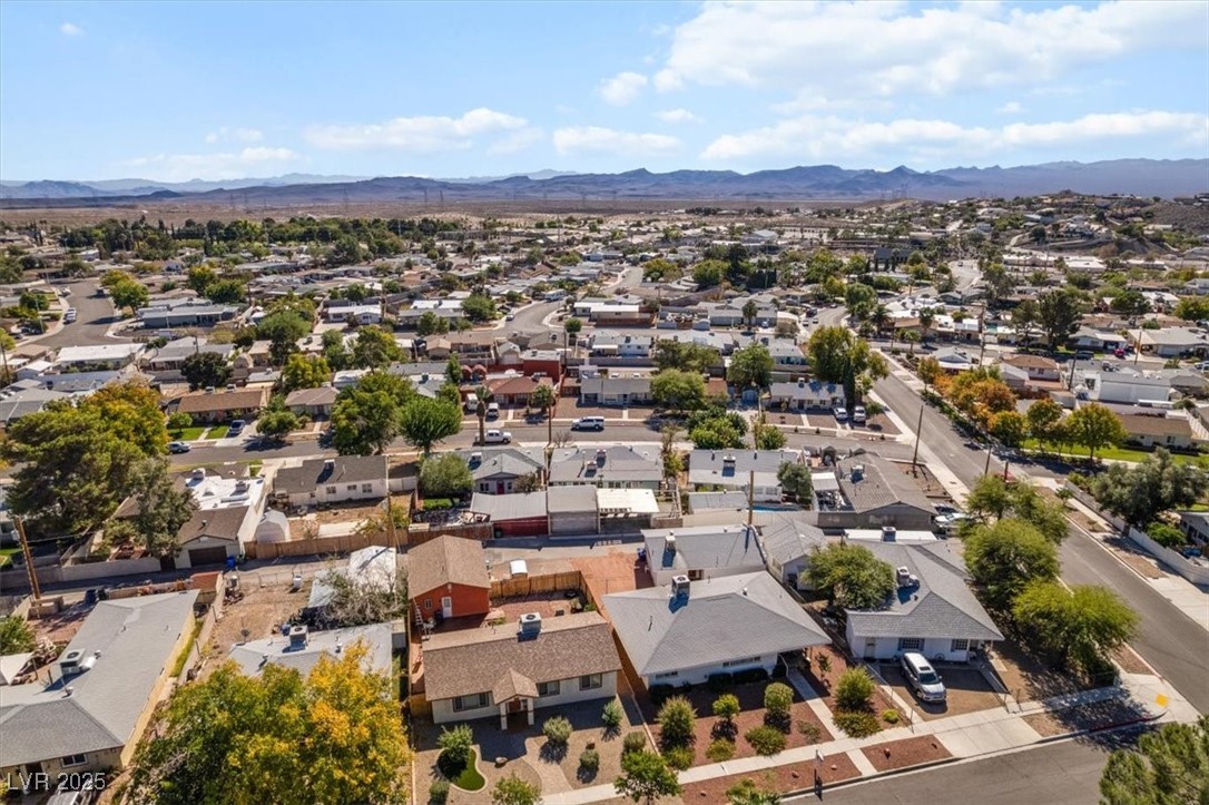 556 7th Street Boulder City, NV 89005 - Photo 32 of 37 Aerial perspective of suburban area featuring mountains