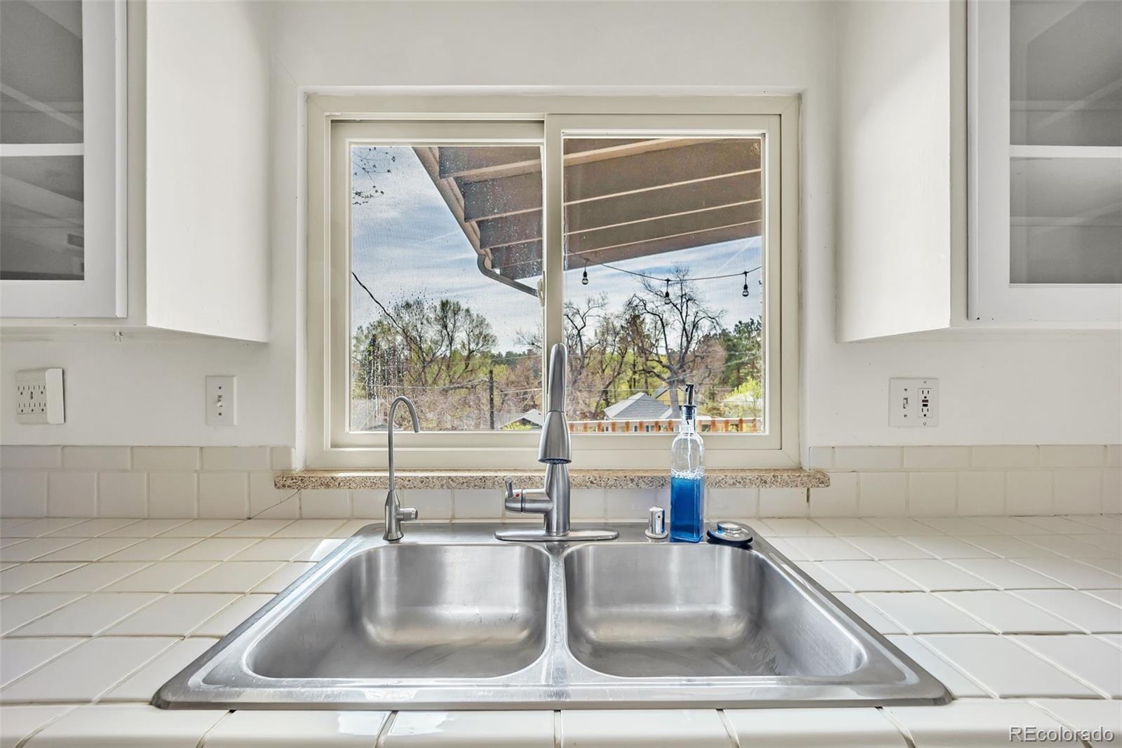 1624 Cheyenne Boulevard Colorado Springs, CO 80906 - Photo 21 of 47 a kitchen with a sink and cabinet