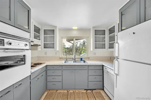 a kitchen with a stove and a microwave