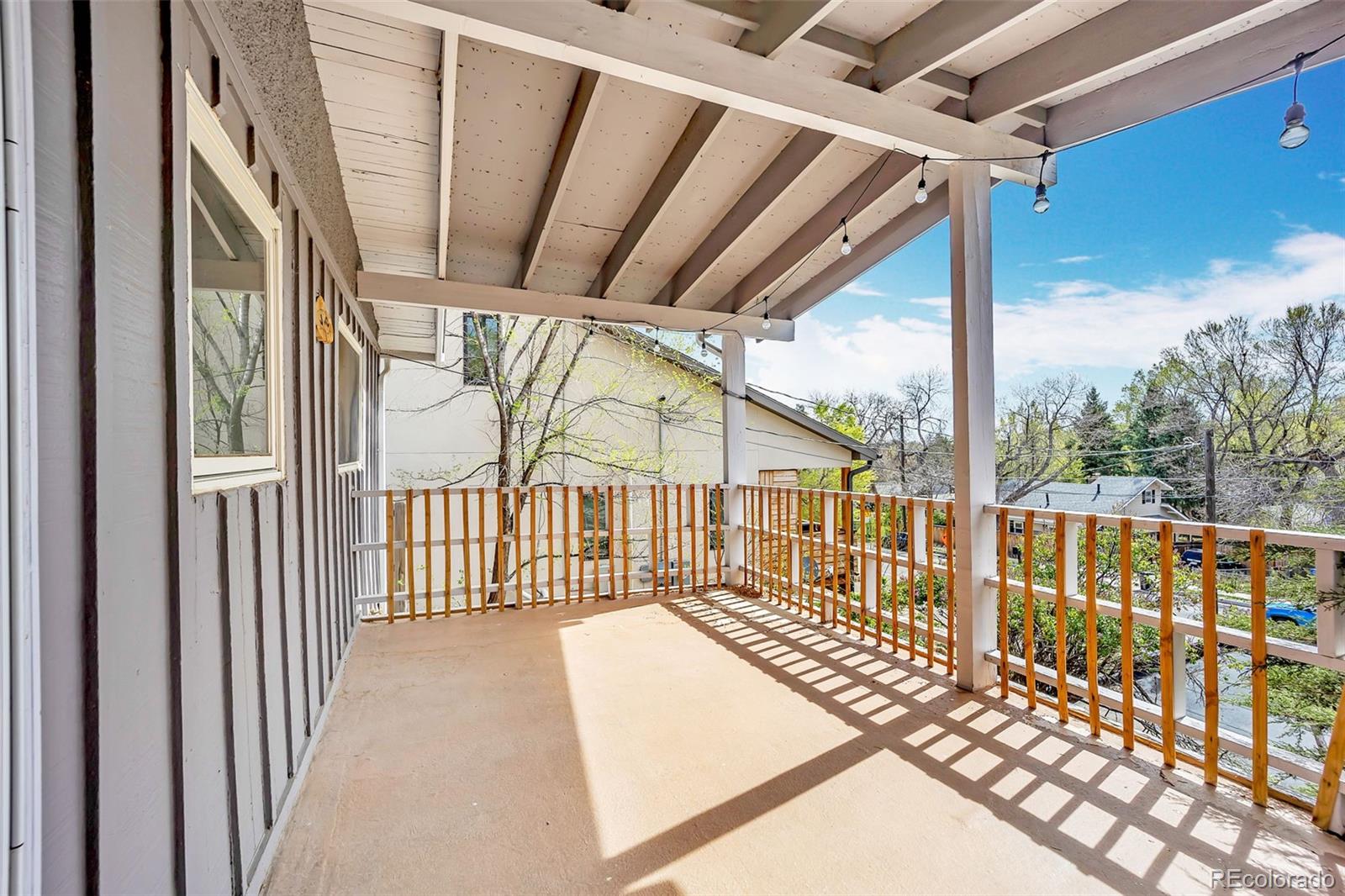 1624 Cheyenne Boulevard Colorado Springs, CO 80906 - Photo 30 of 47 a view of a porch with wooden floor