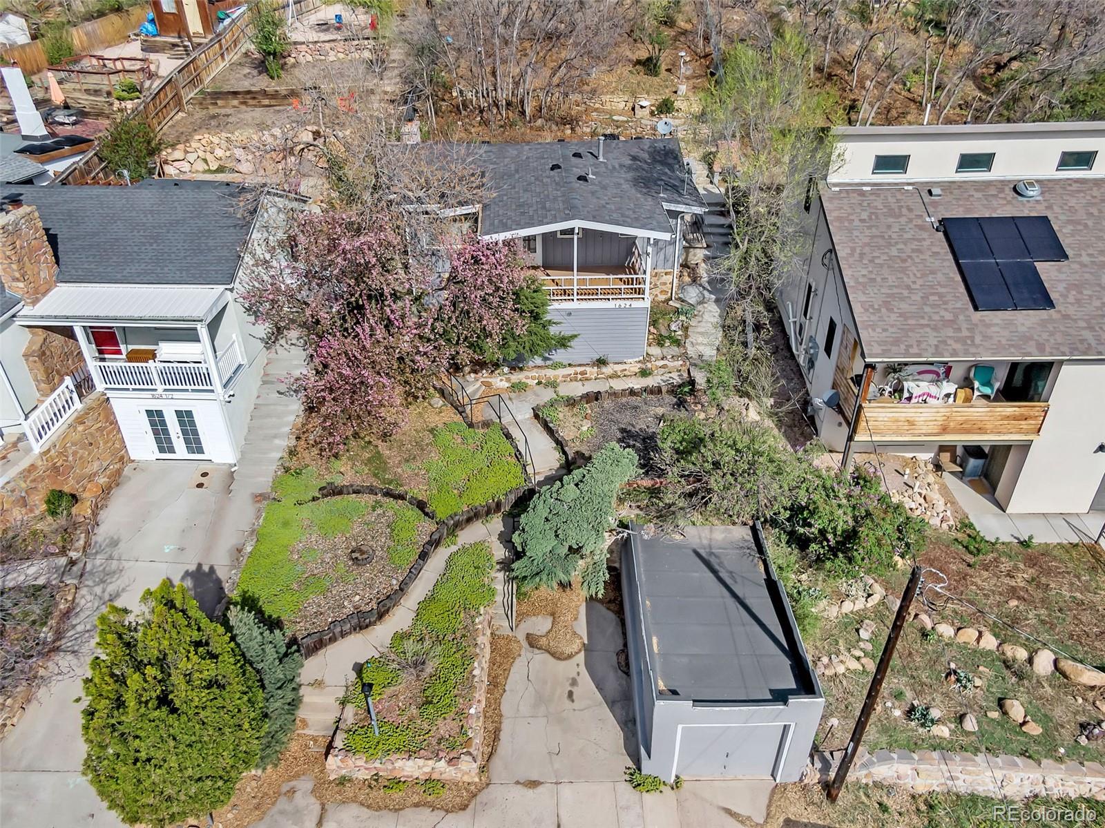 1624 Cheyenne Boulevard Colorado Springs, CO 80906 - Photo 36 of 47 an aerial view of a house with a yard and potted plants