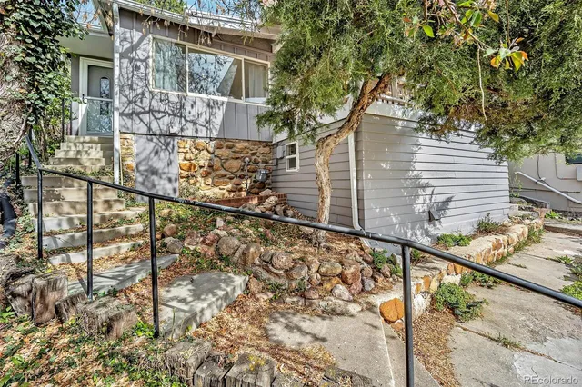a view of a house with a tree