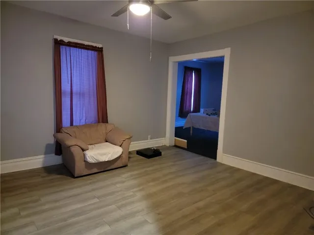a bedroom with a bed and a chair