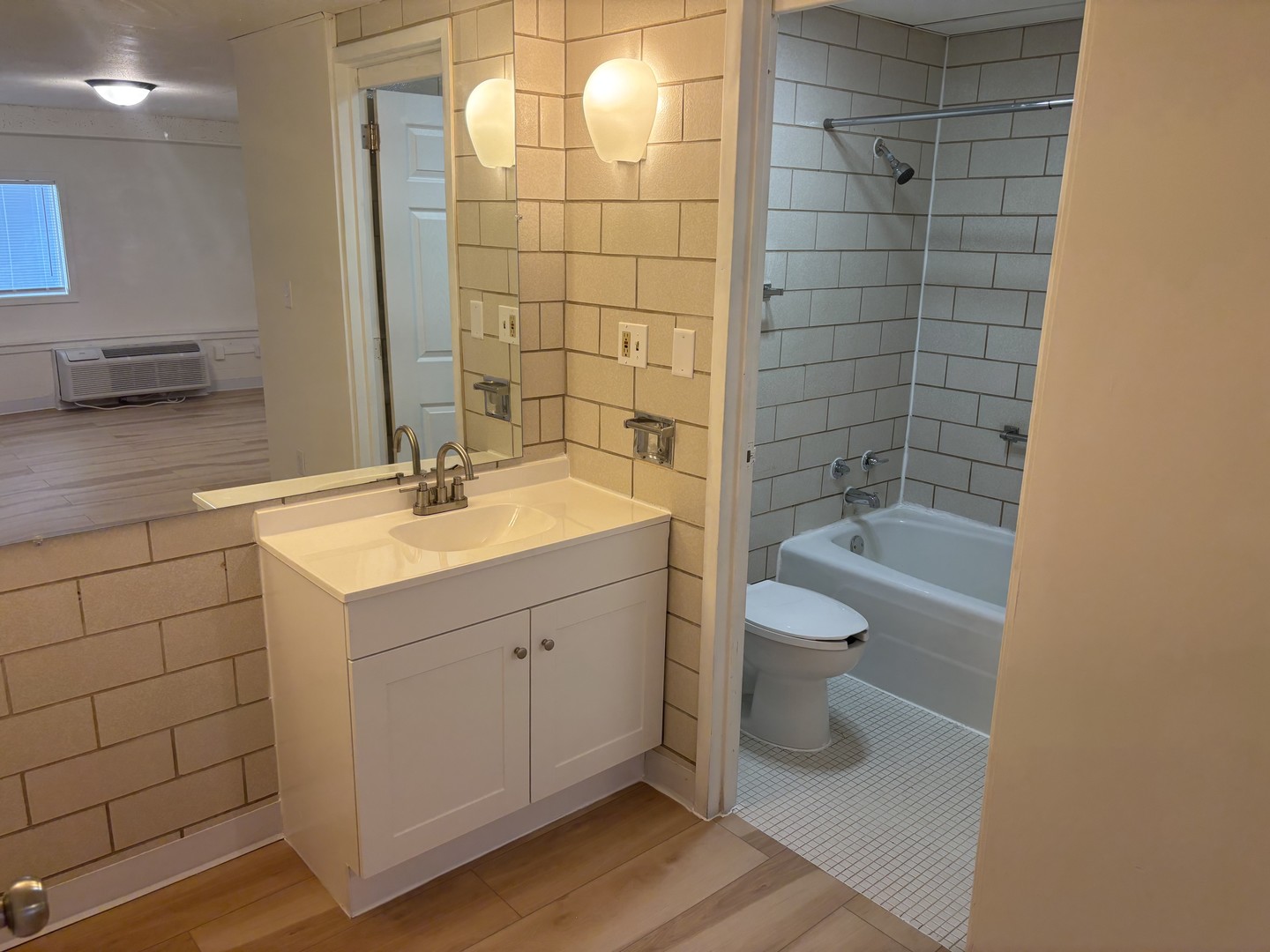 1231 North Galena Avenue, Unit 212 Dixon, IL 61021 - Photo 7 of 7 a bathroom with a sink a toilet and shower