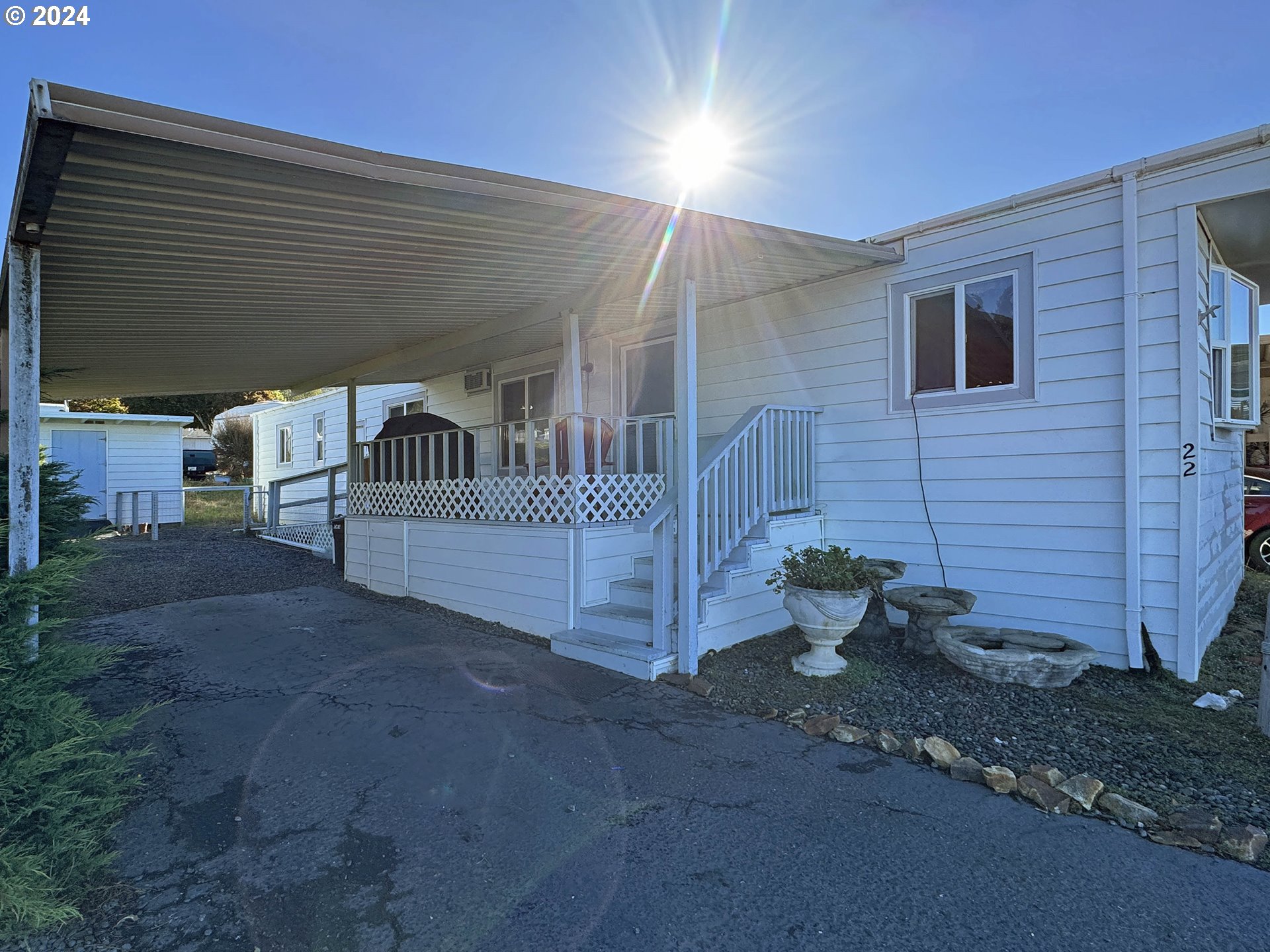 97972 Hallway Road, Unit 22 Brookings, OR 97415 - Photo 3 of 46 a view of a patio with a yard
