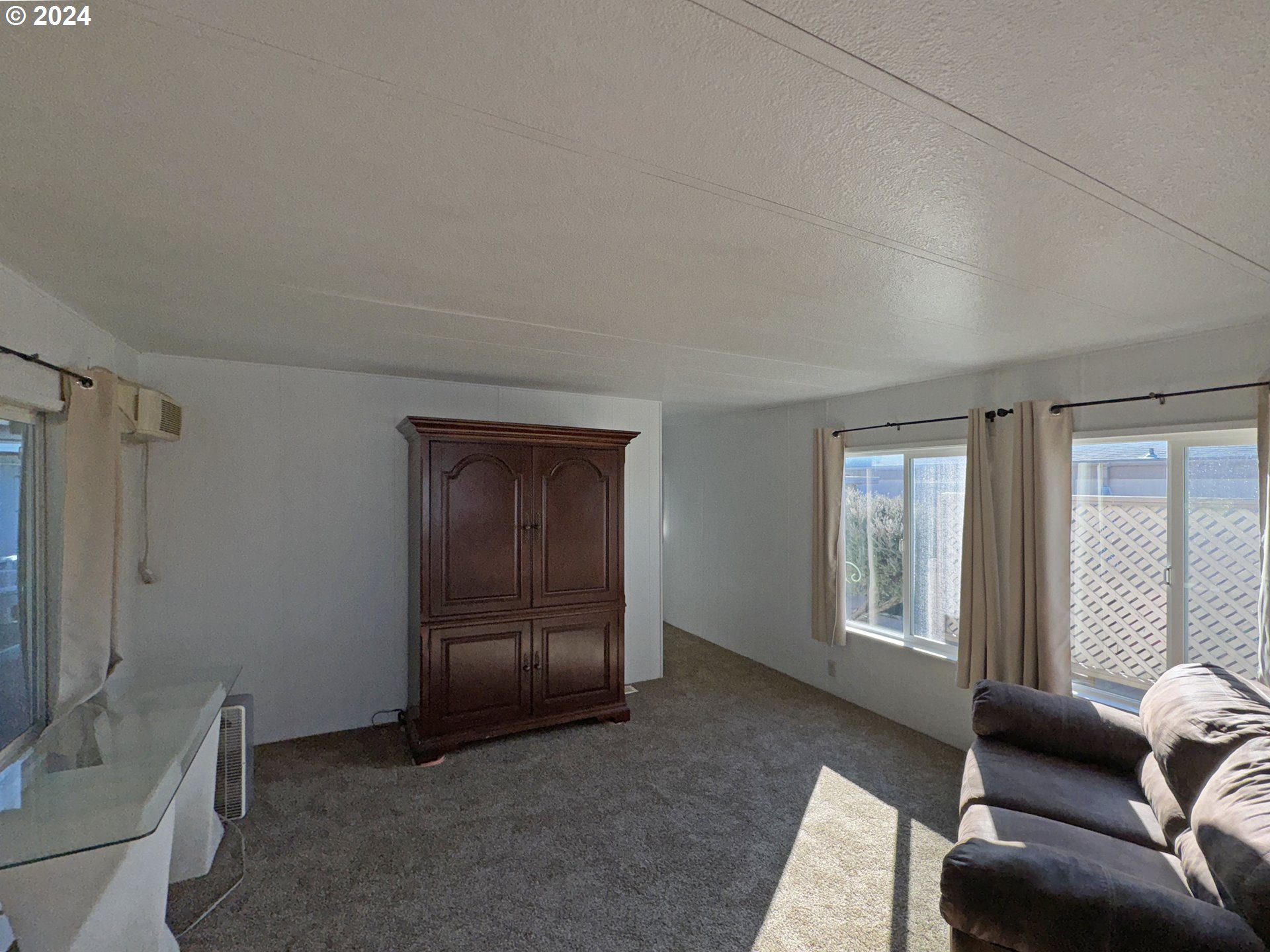 97972 Hallway Road, Unit 22 Brookings, OR 97415 - Photo 38 of 46 a living room with furniture and a window