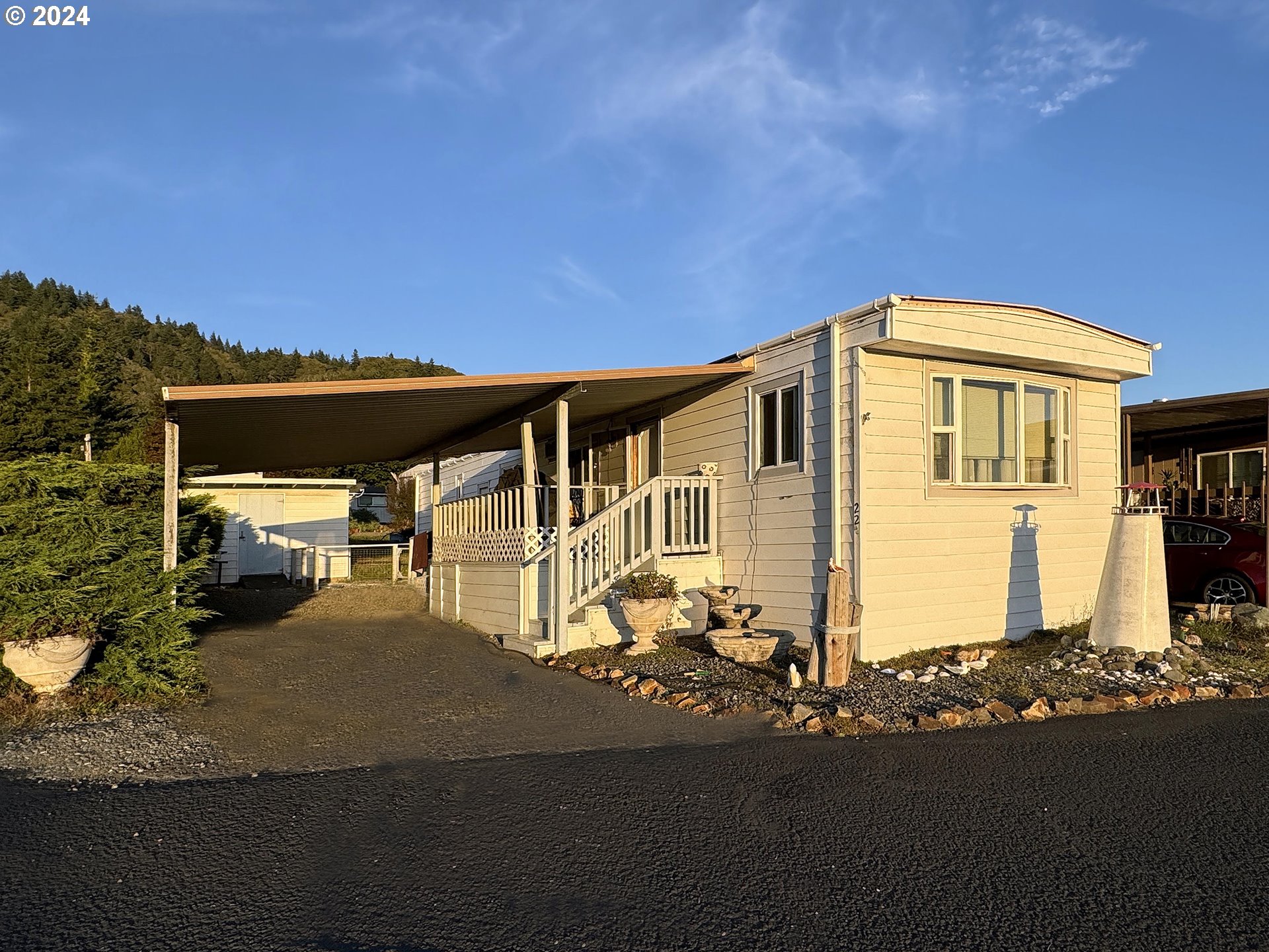 97972 Hallway Road, Unit 22 Brookings, OR 97415 - Photo 40 of 46 a front view of a house with a yard