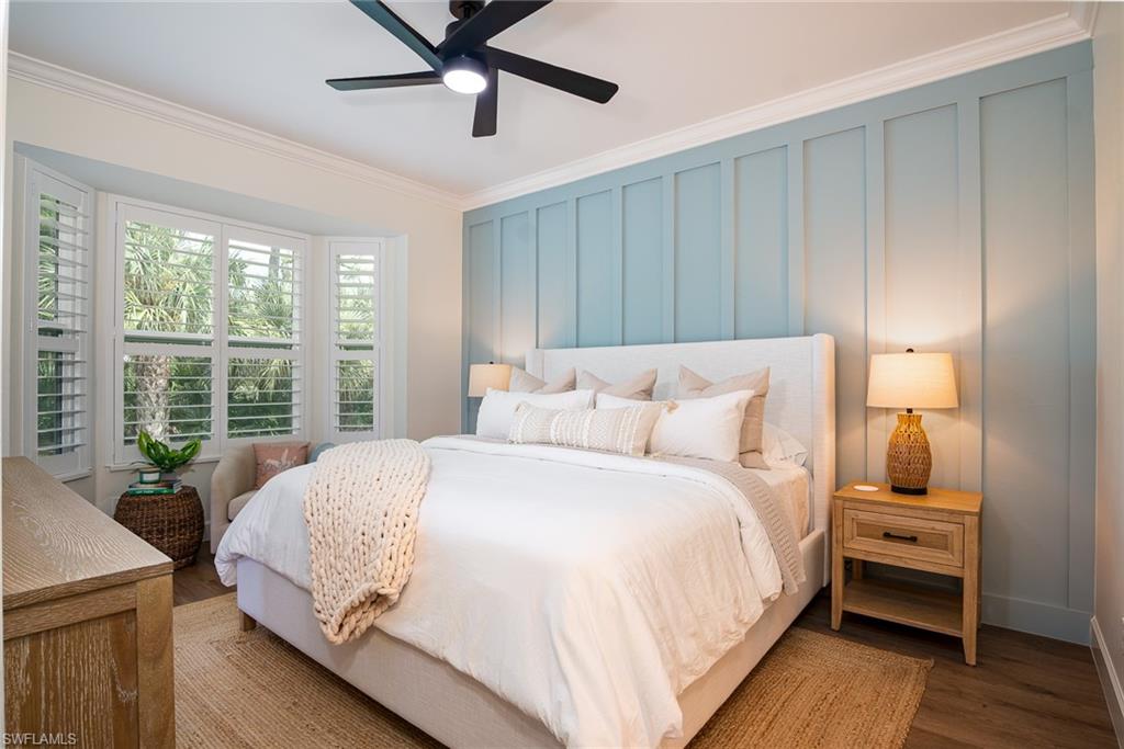 21441 Knighton Run Estero, FL 33928 - Photo 12 of 50 a large bed sitting in a bedroom next to a window