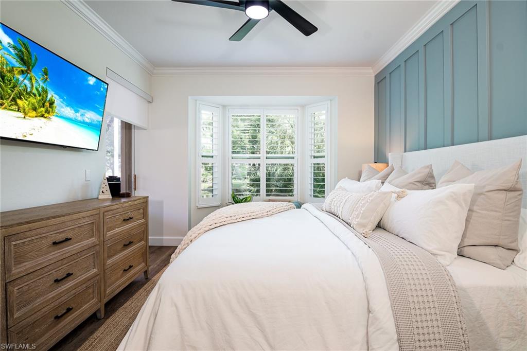 21441 Knighton Run Estero, FL 33928 - Photo 13 of 50 a bedroom with a bed and a window